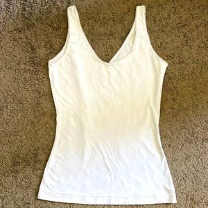 Silky white body con tank top. Brand new.